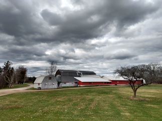 gloomy skies above a large barn